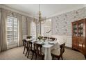 Traditional dining room with wallpaper, a chandelier and dining table at 2842 Dover Nw Rd, Atlanta, GA 30327