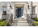 Close-up of the home's front entrance and a blue front door at 2842 Dover Nw Rd, Atlanta, GA 30327