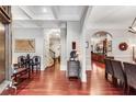 Grand foyer with hardwood floors, detailed millwork, and open sightlines into other living spaces at 1109 Pine Grove Ne Ave, Brookhaven, GA 30319