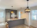 Modern kitchen showcasing a center island with granite countertops and stainless steel appliances at 121 Thirkield Se Ave, Atlanta, GA 30315