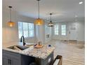 Open-concept kitchen and living area featuring recessed lighting and stainless steel appliances at 121 Thirkield Se Ave, Atlanta, GA 30315