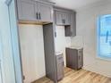 New kitchen cabinets in gray with a granite countertop and a modern backsplash at 121 Thirkield Se Ave, Atlanta, GA 30315