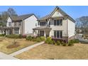 Well-maintained home featuring a landscaped yard and neutral exterior, side view at 241 3Rd Ave, Avondale Estates, GA 30002