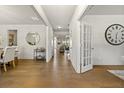 Inviting foyer and hallway showcases hardwood floors, a decorative mirror, and a view into the living spaces at 241 3Rd Ave, Avondale Estates, GA 30002