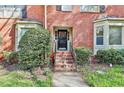 Brick front entrance with stairs leading to a black front door with the address 1384 at 1384 Sheffield Glen Ne Way, Atlanta, GA 30329