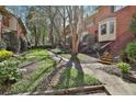 Landscaped front yard featuring stone walkways and lush green spaces enhancing curb appeal at 1384 Sheffield Glen Ne Way, Atlanta, GA 30329