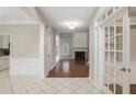 Open-concept home featuring hardwood floors, fireplace, and a view from the foyer at 1603 Pinder Point Dr, Lawrenceville, GA 30043