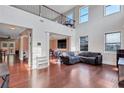 Bright and airy living room with high ceilings, large windows, and hardwood floors at 1606 Kenilworth Se Ln, Conyers, GA 30013