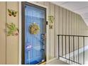 Welcoming front entrance with a security door and decorative floral and butterfly embellishments at 1281 Branch Dr, Tucker, GA 30084