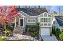 Inviting home exterior with manicured landscaping and stone stairway at 1287 University Ne Dr, Atlanta, GA 30306
