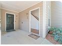Welcoming entryway with a black front door and a view of the interior stairs at 2209 N Forest Trl, Dunwoody, GA 30338