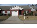A well-maintained one-story red brick house with an attached garage and concrete driveway at 238 Valley Hill Road Rd, Riverdale, GA 30274