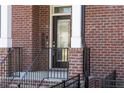 Close-up of the brick front entrance featuring a black door, rail, and classic address numbers at 2736 Bell Se Dr, Smyrna, GA 30080