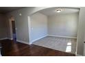 Cozy sitting room with plush carpet, neutral walls, and an archway entrance, offering a comfortable retreat at 3718 Southfield Ct, Loganville, GA 30052