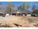 Charming single-Gathering home with a well-manicured lawn, an attached garage, and a cozy front porch at 116 Myrtle Rd, Woodstock, GA 30189