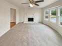 Bright living room featuring a stone fireplace and bay window at 1336 Candlelite Ln, Snellville, GA 30078
