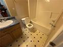 Simple bathroom featuring a toilet, tub/shower combo, and vanity with sink at 2863 Windsor Forrest Ct, Atlanta, GA 30349