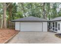 View of the detached garage with a spacious driveway, offering ample parking at 105 Simonton (Tract 1) Se Rd, Lawrenceville, GA 30046