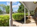Cozy front porch view showcasing seating, landscaping, and a glimpse of the neighborhood at 4315 Summit Heights Dr, Snellville, GA 30039