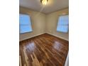 Inviting bedroom with beautiful hardwood flooring and ample sunlight streaming through the windows at 2368 Jernigan Se Pl, Atlanta, GA 30315