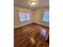 Bright bedroom boasts gleaming hardwood floors and plenty of natural light from large windows at 2368 Jernigan Se Pl, Atlanta, GA 30315