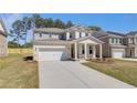 Lovely two-story house showcasing a spacious driveway and manicured front yard at 624 Leafy Branch Way, Mcdonough, GA 30253