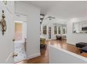 Open-concept living room featuring hardwood floors and a bathroom adjacent to the entrance at 1078 Piedmont Ne Ave # 203, Atlanta, GA 30309