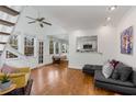 Bright living room with hardwood floors, a ceiling fan, and an adjacent kitchen view at 1078 Piedmont Ne Ave # 203, Atlanta, GA 30309