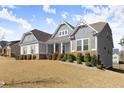 Well-maintained home with stone accents, shutters, and a spacious front yard at 125 Whitman Grv, Fayetteville, GA 30215