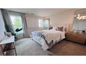 Bright bedroom featuring a large window, comfortable bed, and stylish decor creating a relaxing atmosphere at 113 Chestnut Trce # 8, Hapeville, GA 30354