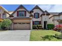 Charming two-story home with a two-car garage, brick accents, and a well-manicured front lawn at 3517 Harvest Ridge Ln, Buford, GA 30519