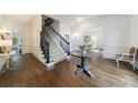 Spacious foyer with hardwood floors, stairs, and decorative trim creating a luxurious entrance at 2005 Westbourne Way, Alpharetta, GA 30022