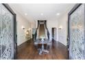 Grand foyer boasts hardwood floors, staircase, and decorative glass doors, creating an inviting entrance at 2005 Westbourne Way, Alpharetta, GA 30022