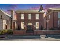 Charming red brick home featuring a classic design, manicured landscaping, and a welcoming entrance at 220 3Rd St, Fayetteville, GA 30214