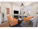 Cozy living room with a fireplace, modern lighting, and a comfortable seating arrangement at 220 3Rd St, Fayetteville, GA 30214