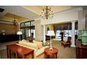 Elegant lobby with comfortable seating, lamps, vases, and chandelier at 300 Peachtree Ne St # 9A, Atlanta, GA 30308