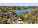 Breathtaking aerial view of lakefront property surrounded by lush greenery at 778 Lakeview Ln, Berkeley Lake, GA 30096