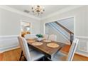 Bright dining room with views of the staircase and a glimpse of the kitchen at 813 Topaz Vly, Canton, GA 30114