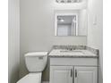 Well-lit bathroom with sleek granite counters and modern fixtures creates a comfortable and stylish space at 4322 Idlewood Ln, Tucker, GA 30084