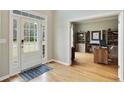 Welcoming entrance to the home office featuring hardwood floors, natural light, and a cozy atmosphere at 819 Holly Rdg, Canton, GA 30115