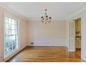 Traditional dining room with hardwood floors and a large window for ample natural light at 3474 Castleridge Dr, Tucker, GA 30084