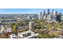 Stunning aerial view showcases the city skyline, lush green trees, and the surrounding neighborhood at 375 Ralph Mcgill Ne Blvd # 502, Atlanta, GA 30312