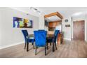 Chic dining area with a round table, stylish blue chairs, and an open view to the kitchen at 375 Ralph Mcgill Ne Blvd # 502, Atlanta, GA 30312