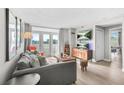 Inviting living room with a comfortable sofa, stylish furniture, and bright natural light from the balcony doors at 375 Ralph Mcgill Ne Blvd # 502, Atlanta, GA 30312