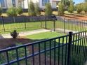 View of private backyard with a fence surrounding grass and plants at 634 Skytop Dr # 155, Cumming, GA 30040