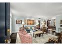 Inviting living room with stylish decor, comfortable seating, and an open layout leading to the dining space at 2260 Peachtree Nw Rd # D6, Atlanta, GA 30309