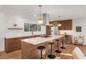 Modern kitchen with a large island, stainless steel appliances, and sleek countertops at 3306 Sleepy Se Ln, Smyrna, GA 30080