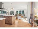 Bright open living space with hardwood floors, large windows, and modern decor at 3306 Sleepy Se Ln, Smyrna, GA 30080
