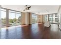 Bright living room with hardwood floors and expansive windows providing beautiful natural light at 1820 Peachtree Nw St # 608, Atlanta, GA 30309