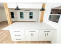 Kitchen island with quartz counters and black pulls at 4336 Parkview Dr, Lithia Springs, GA 30122